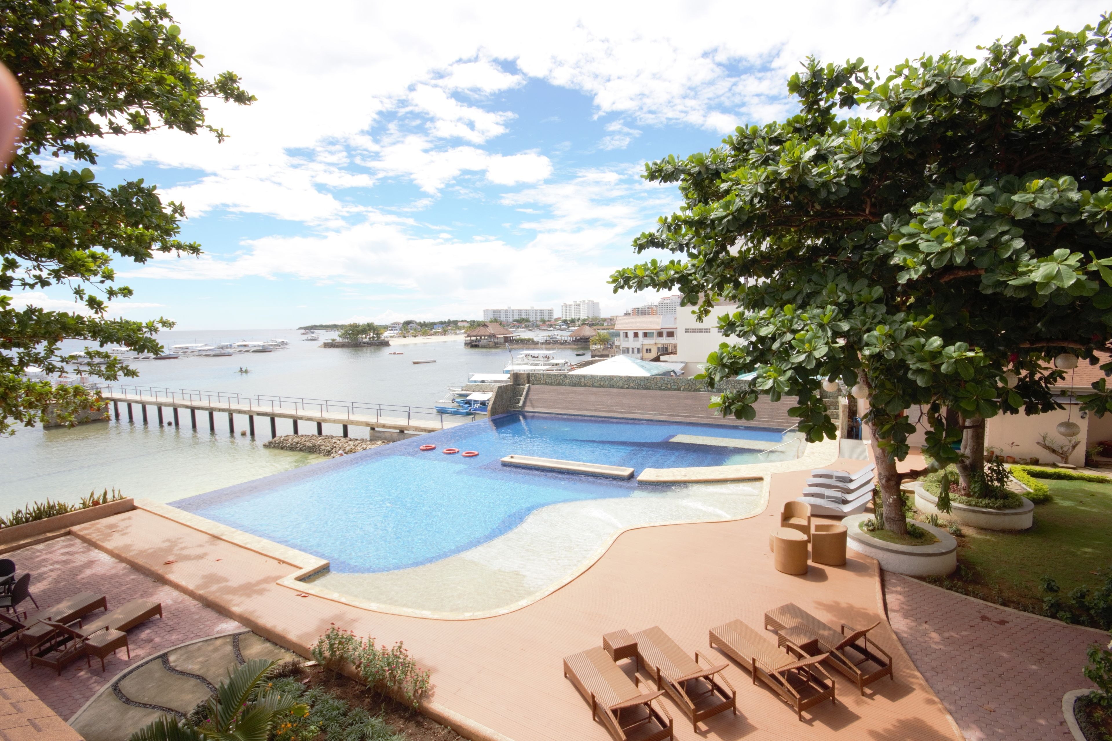 outdoor pool, pool umbrellas, pool loungers