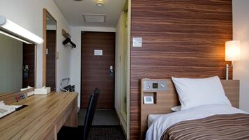 Desk, iron/ironing board, bed sheets