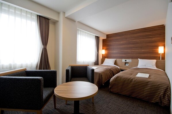 Desk, iron/ironing board, bed sheets