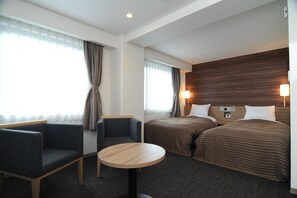 Desk, iron/ironing board, bed sheets