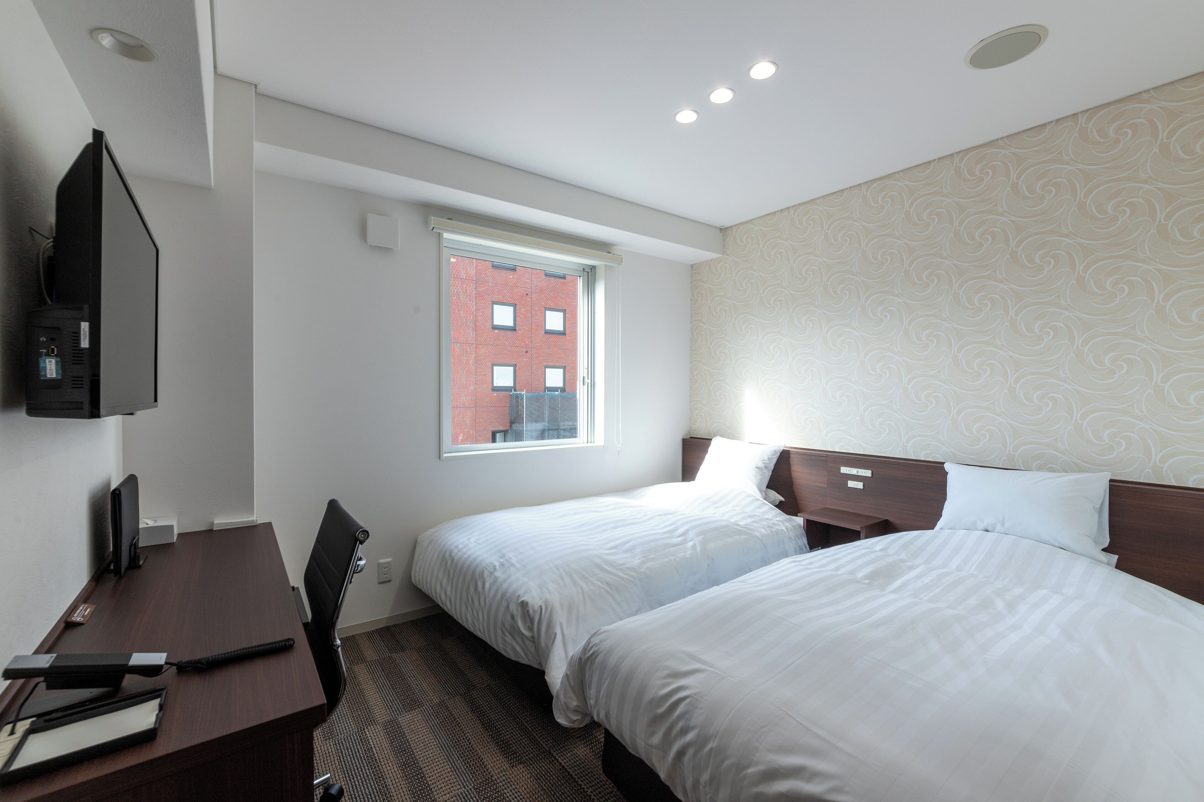 Desk, iron/ironing board, bed sheets