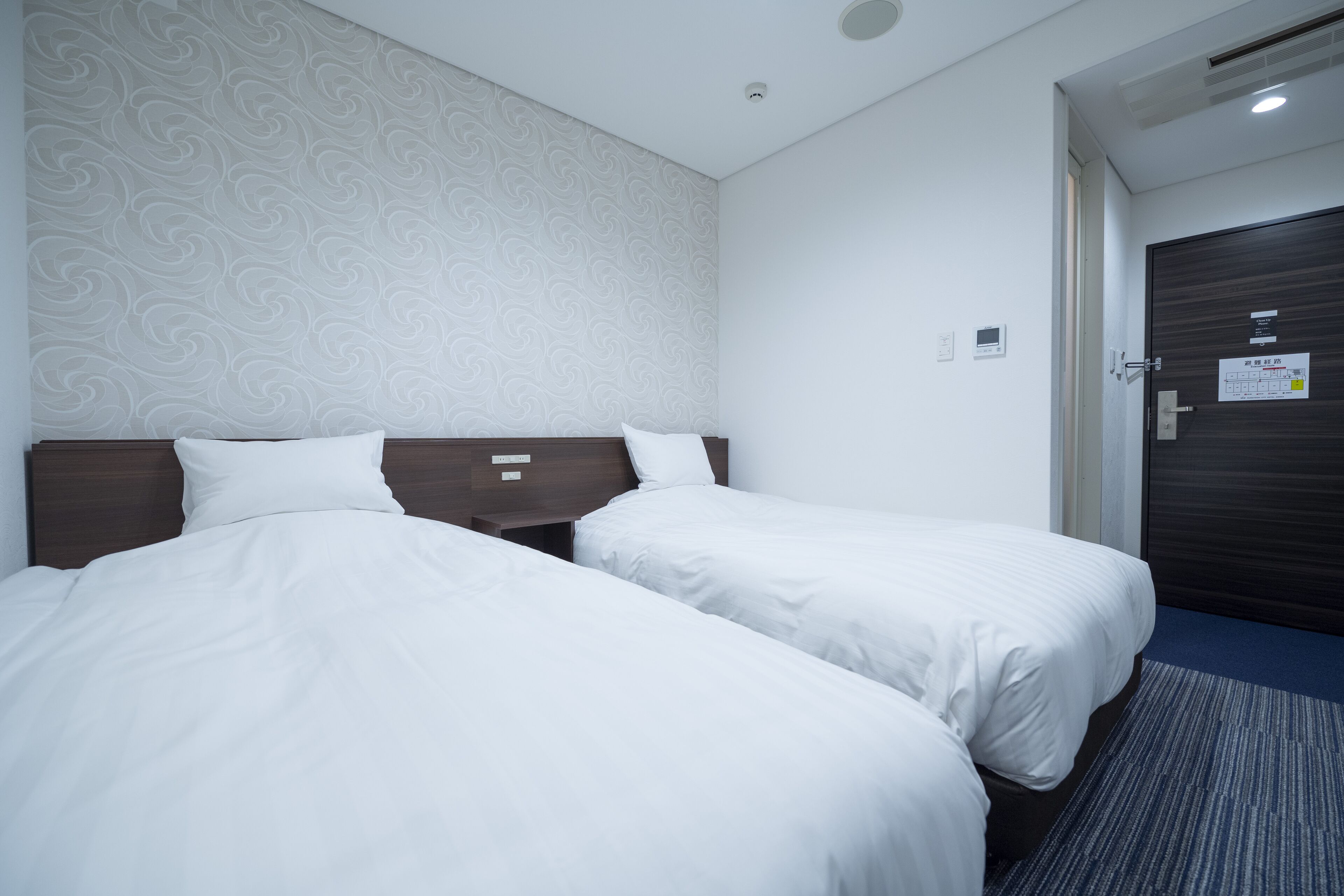 Desk, iron/ironing board, bed sheets