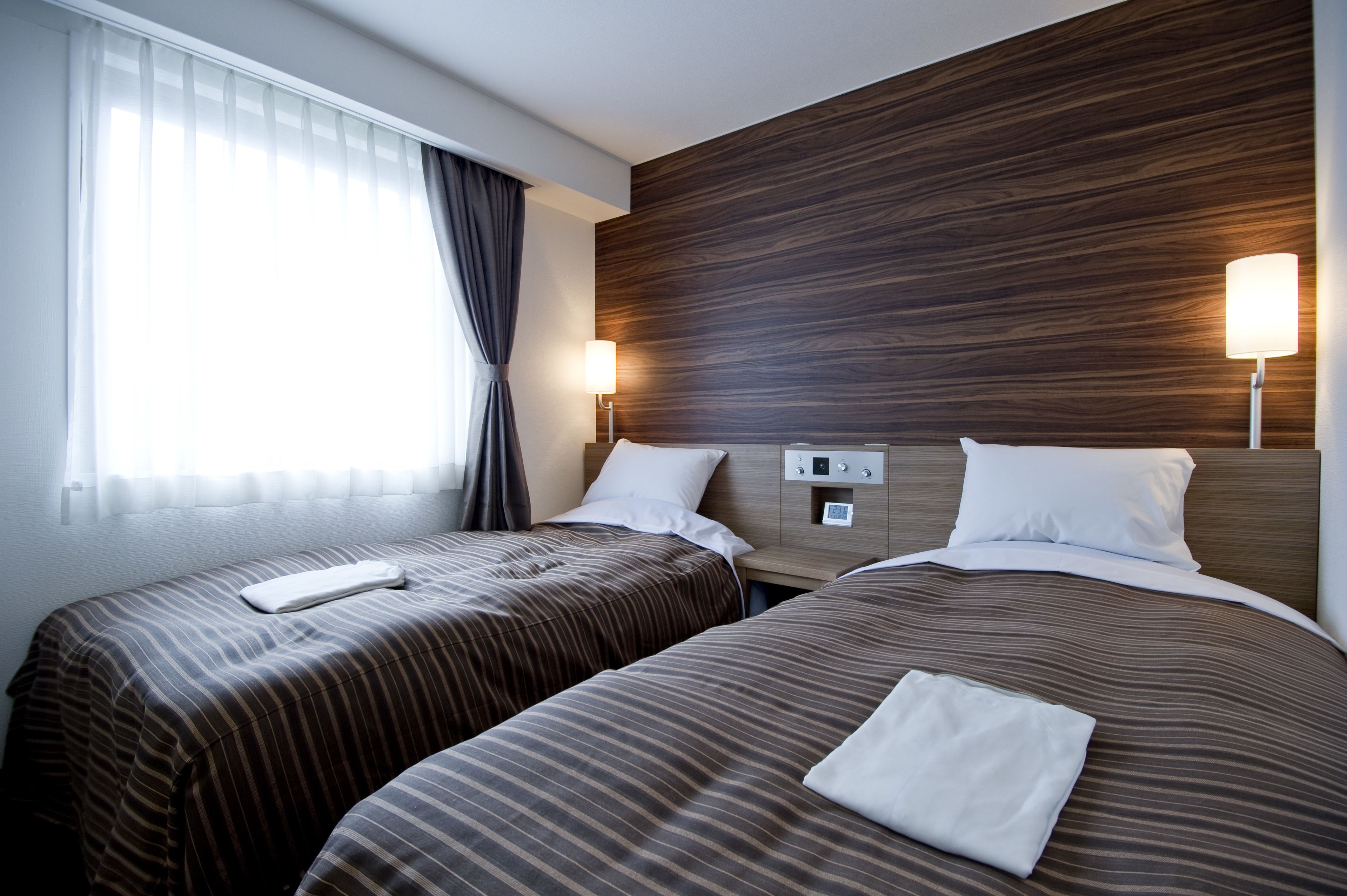 desk, iron/ironing board, bed sheets