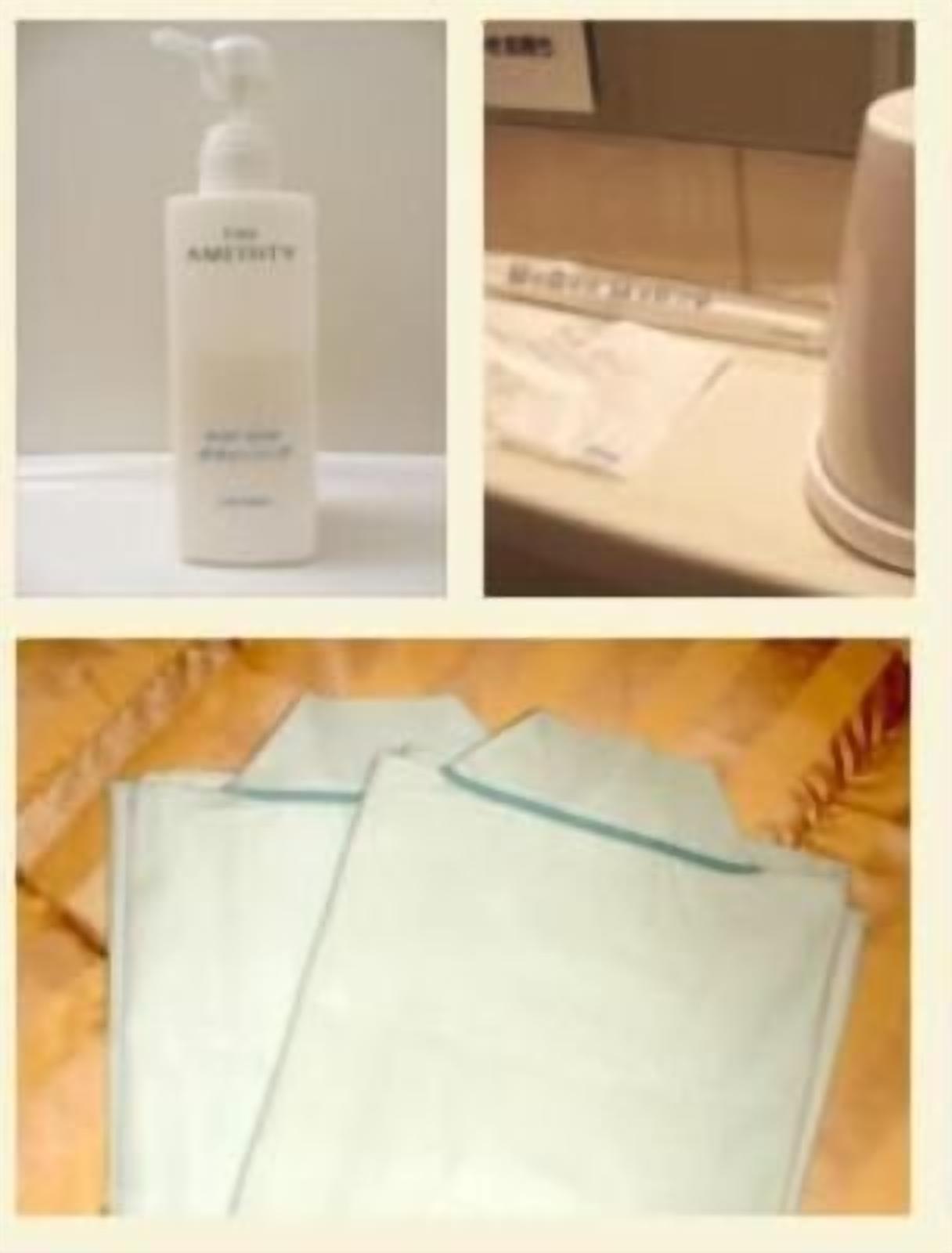 A bathroom with a white bottle of shampoo, a white towel dispenser, and a white towel on the counter.