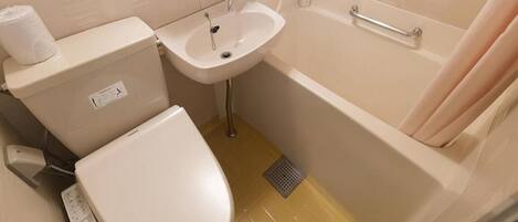A bathroom with a toilet, sink, and bathtub.