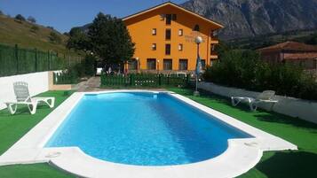 Outdoor pool, pool umbrellas, pool loungers