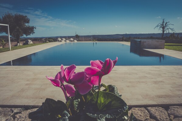 Seasonal outdoor pool, an infinity pool, sun loungers