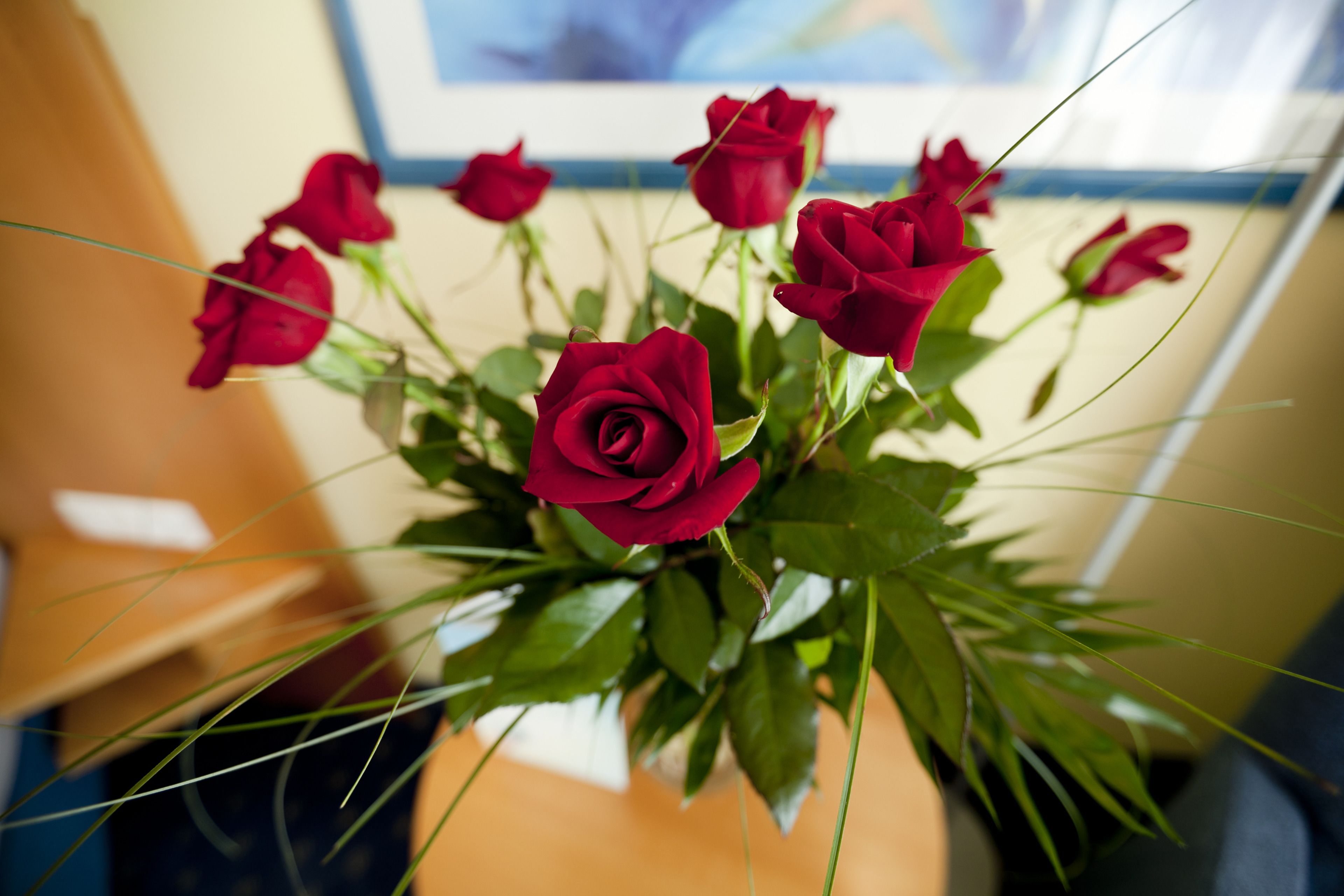 A bouquet of red roses in a vase.