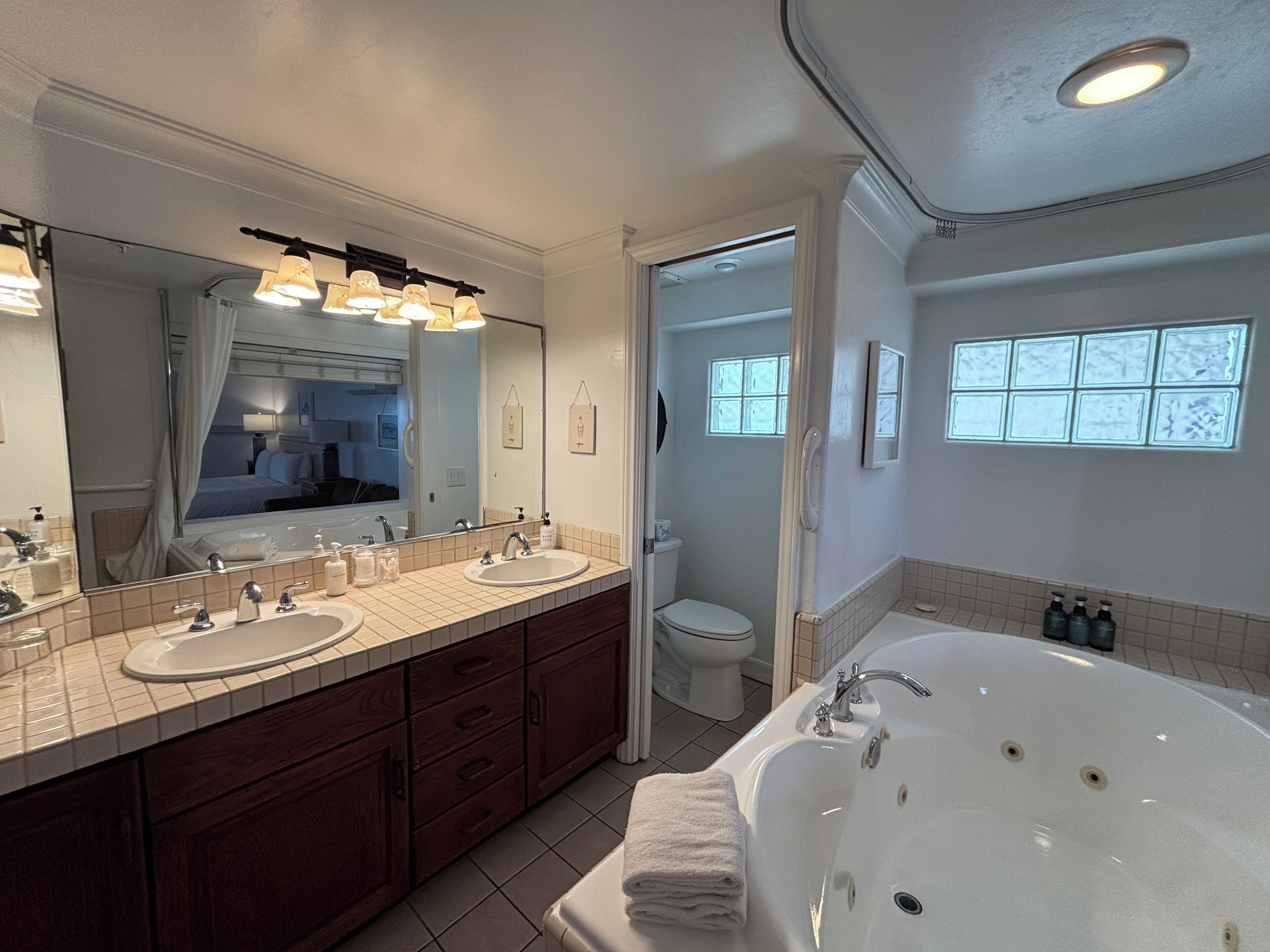 room, 1 king bed, fireplace, partial ocean view | bathroom | free toiletries, bathrobes, towels