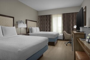Premium bedding, desk, laptop workspace, blackout drapes