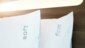 Two pillows with the words "soft" and "firm" on them. - Holiday Inn Express Brisbane Central by IHG (Spring Hill)