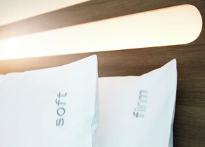 Two pillows with the words "soft" and "firm" on them. - Holiday Inn Express Brisbane Central by IHG (Spring Hill)