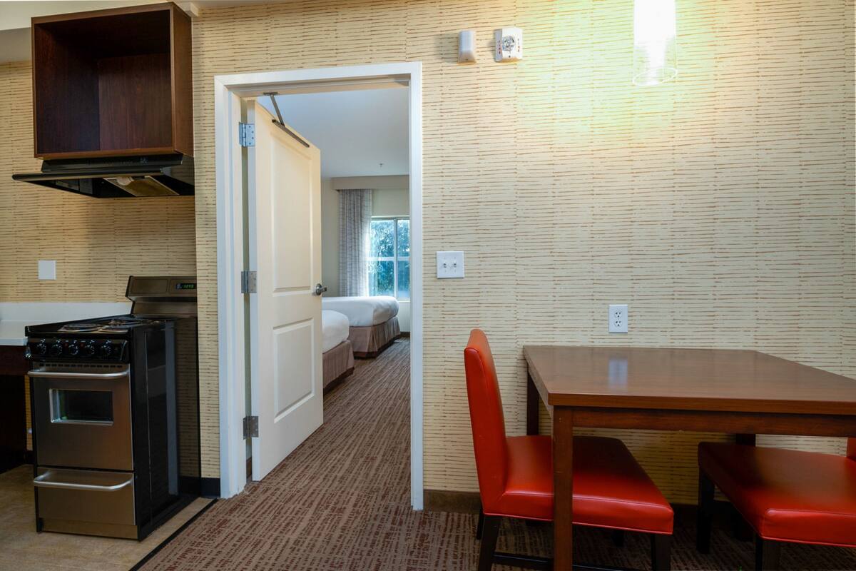 Desk, laptop workspace, blackout curtains, iron/ironing board