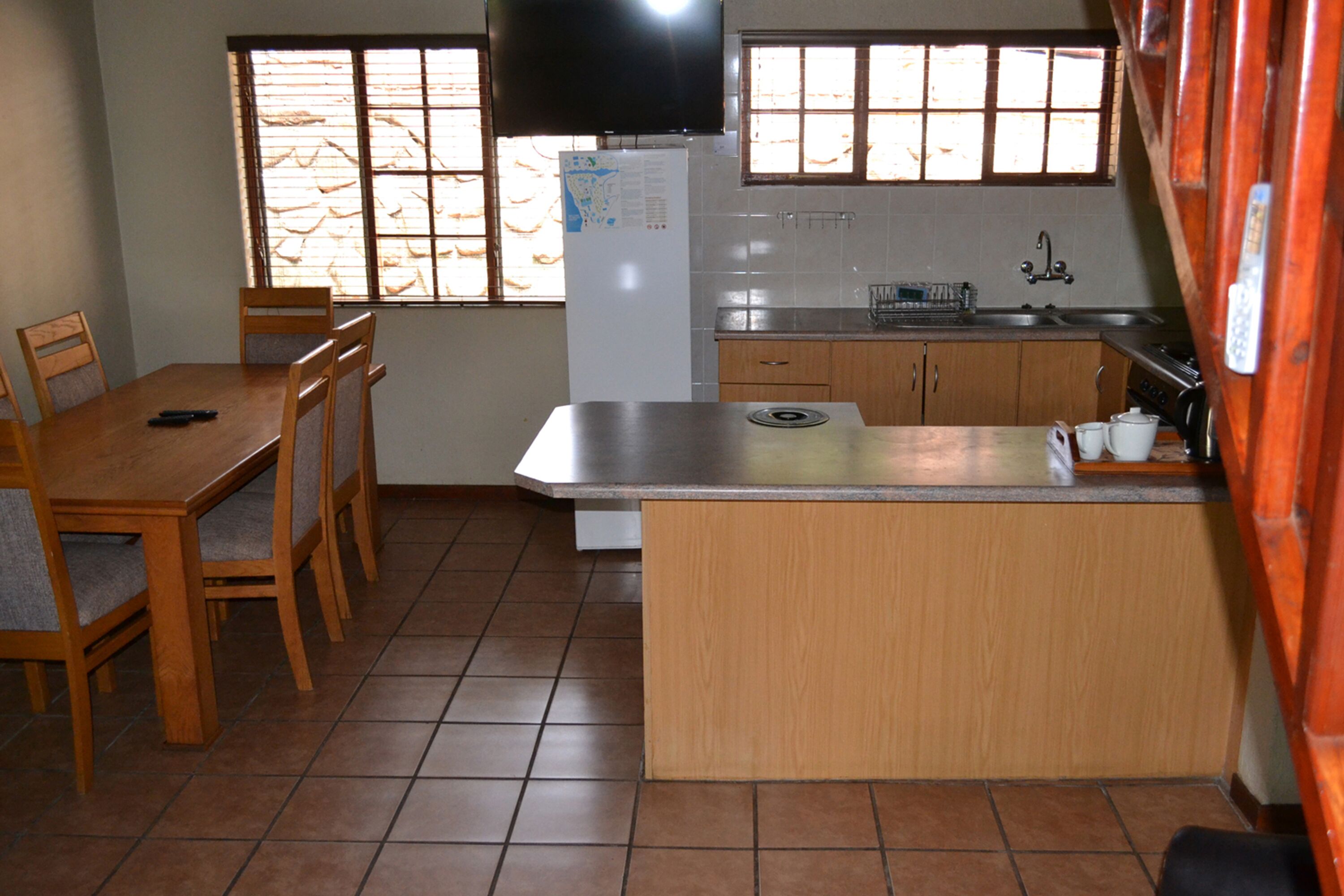 two bedroom chalet with patio | private kitchen | fridge, microwave, oven, stovetop