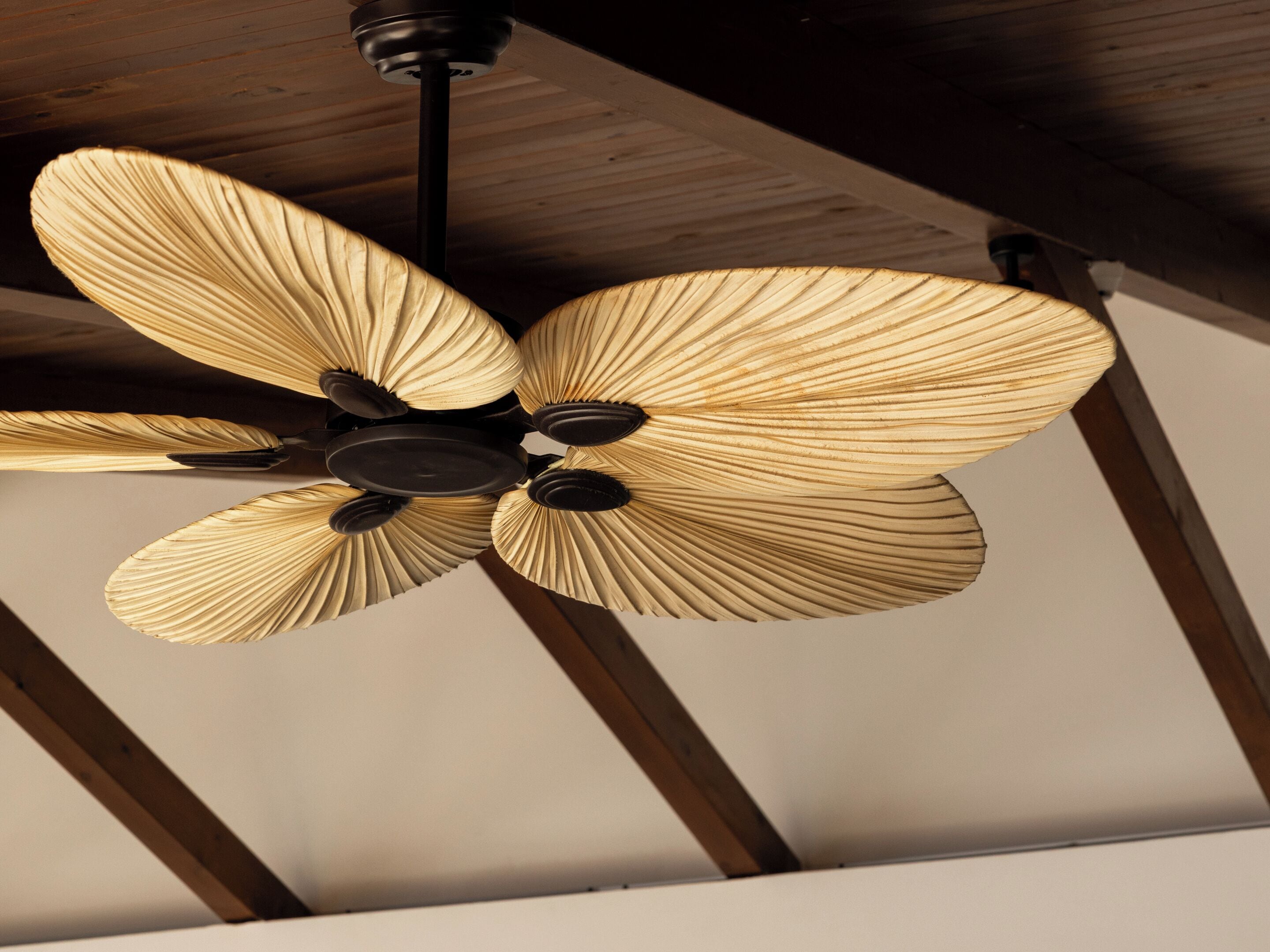 A ceiling fan with a wooden design.