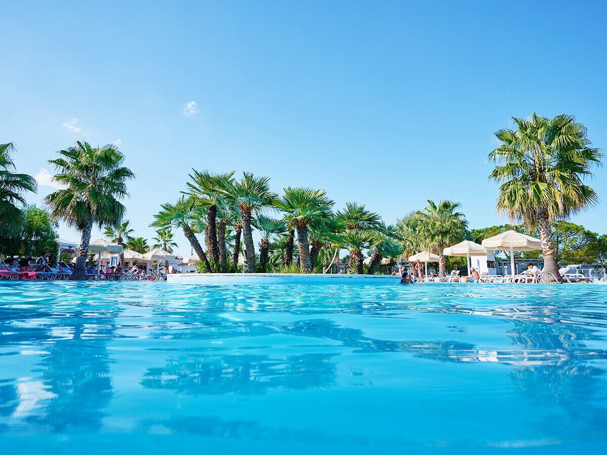 Seasonal outdoor pool, pool umbrellas, pool loungers