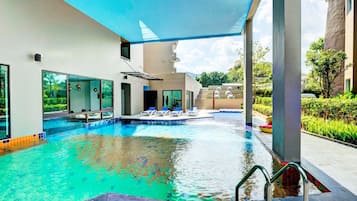 Indoor pool, outdoor pool, pool umbrellas, pool loungers