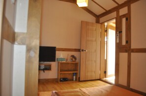 Habitación familiar | Zona de estar | Una televisión de pantalla plana