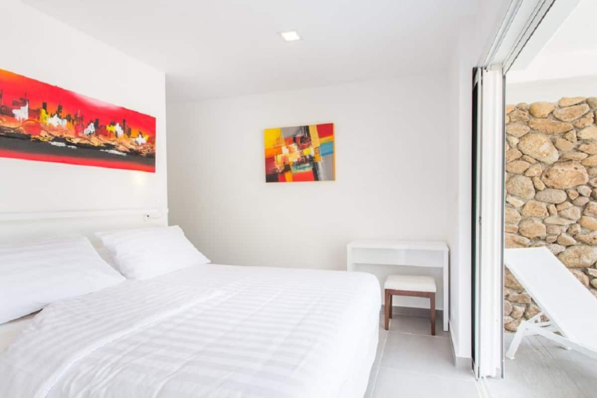 Suite, 1 habitación, vistas al jardín (Garden Suite) | 2 dormitorios, caja fuerte, decoración individual