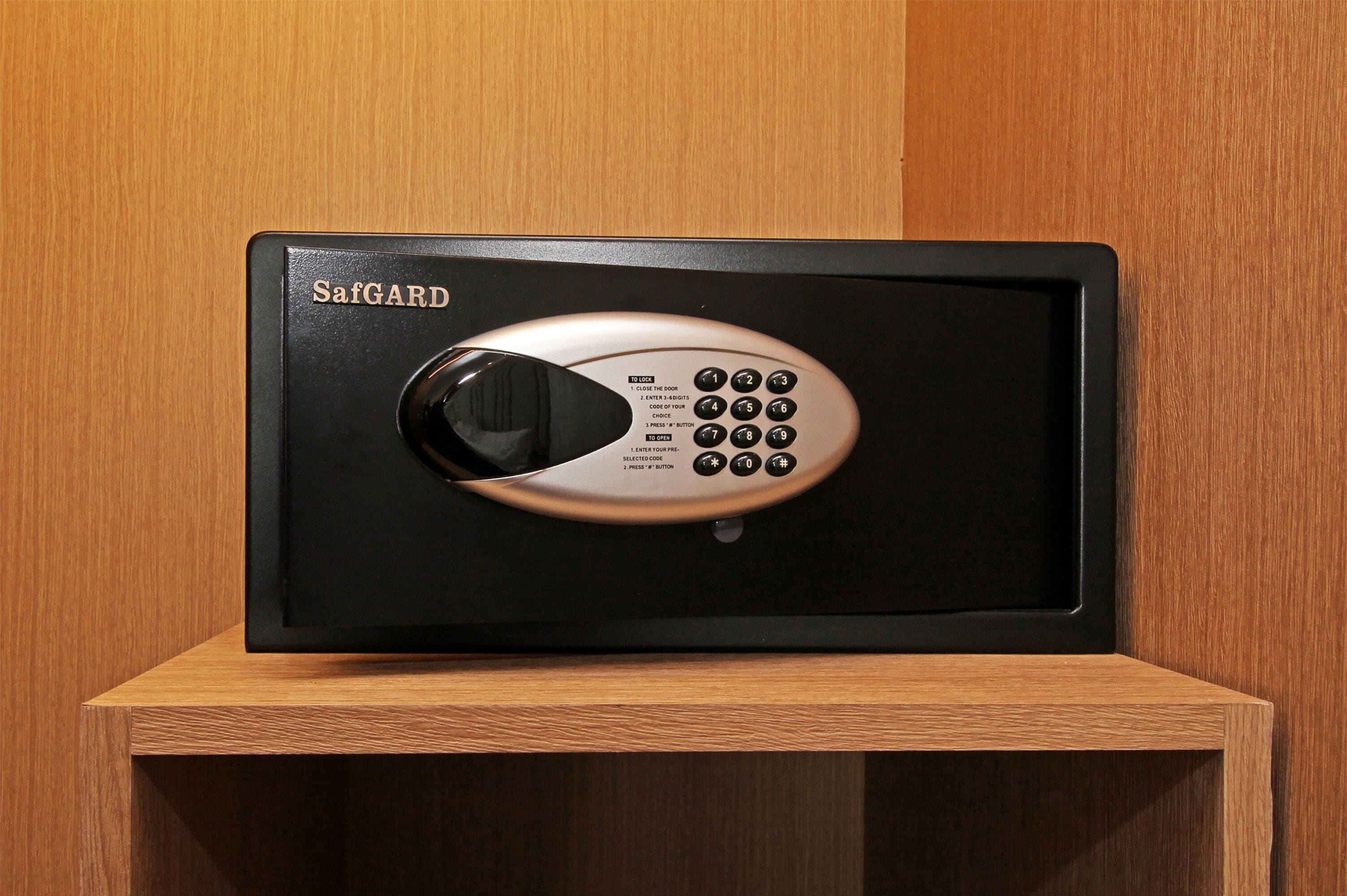 A SafGuard safe with a keypad and a combination lock.