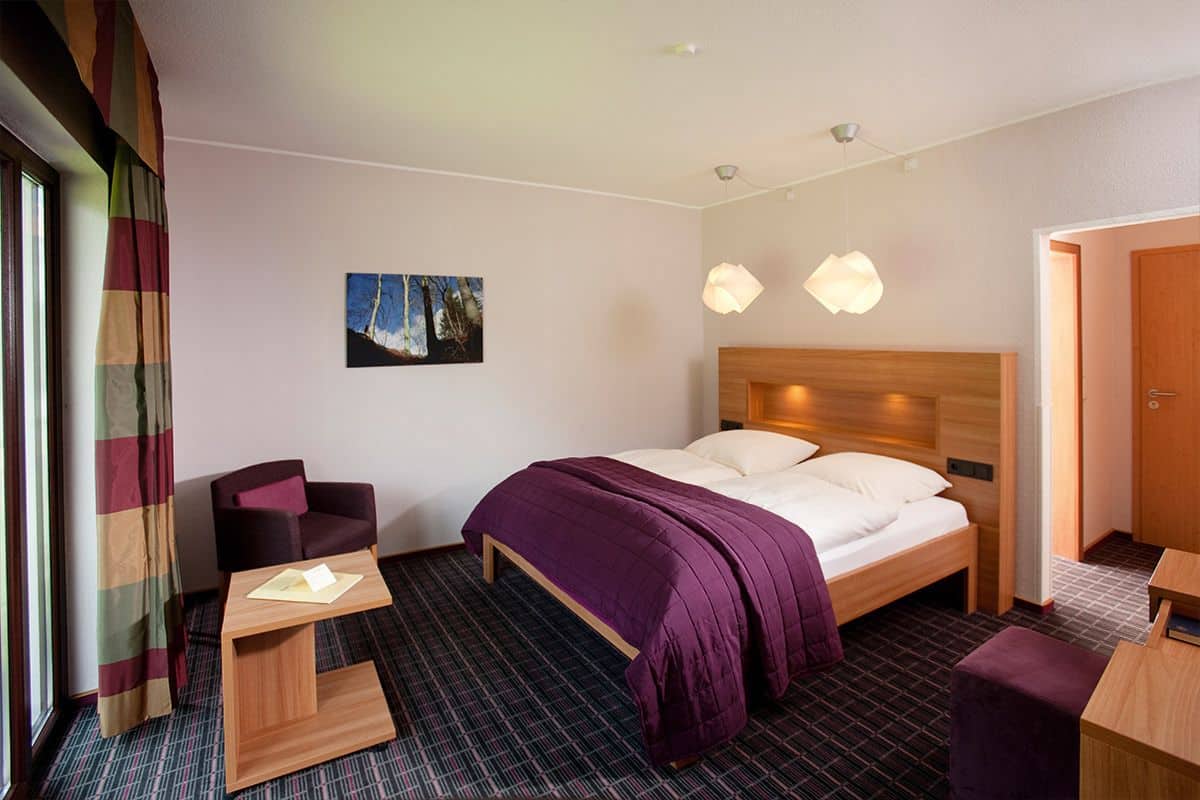 Premium bedding, desk, laptop workspace, blackout curtains