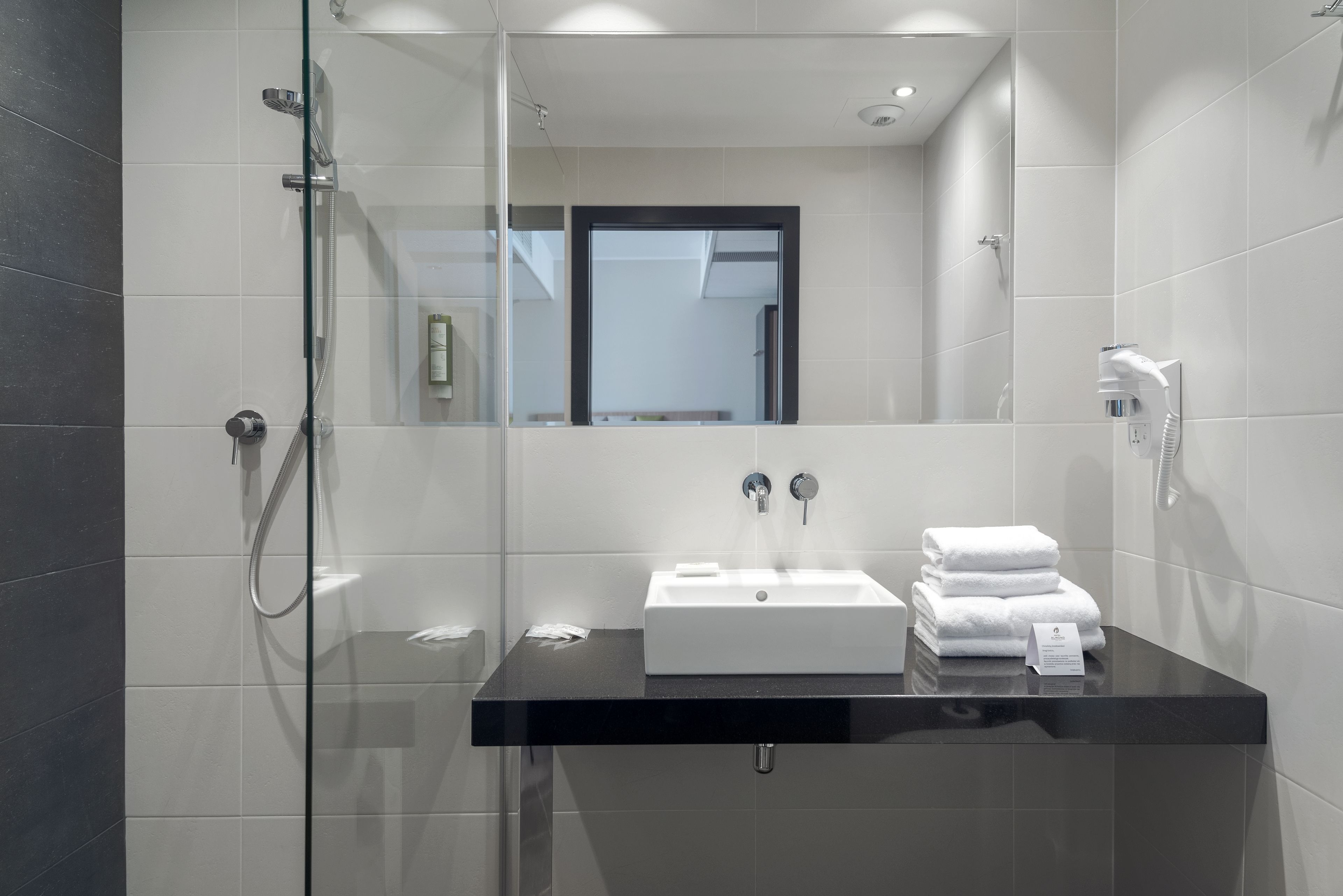 designer toiletries, hair dryer, bathrobes, slippers