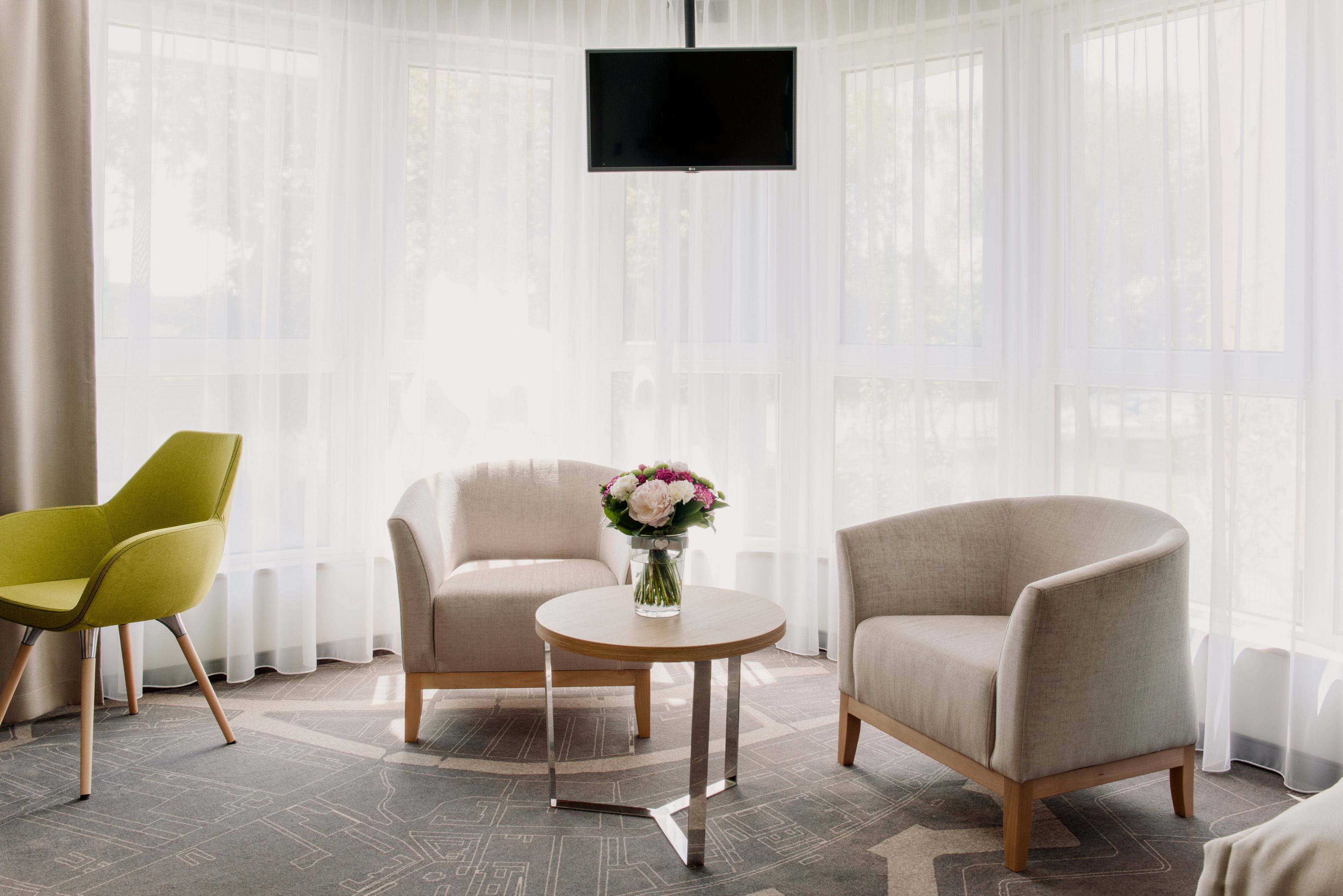 superior double or twin room | living area | flat-screen tv