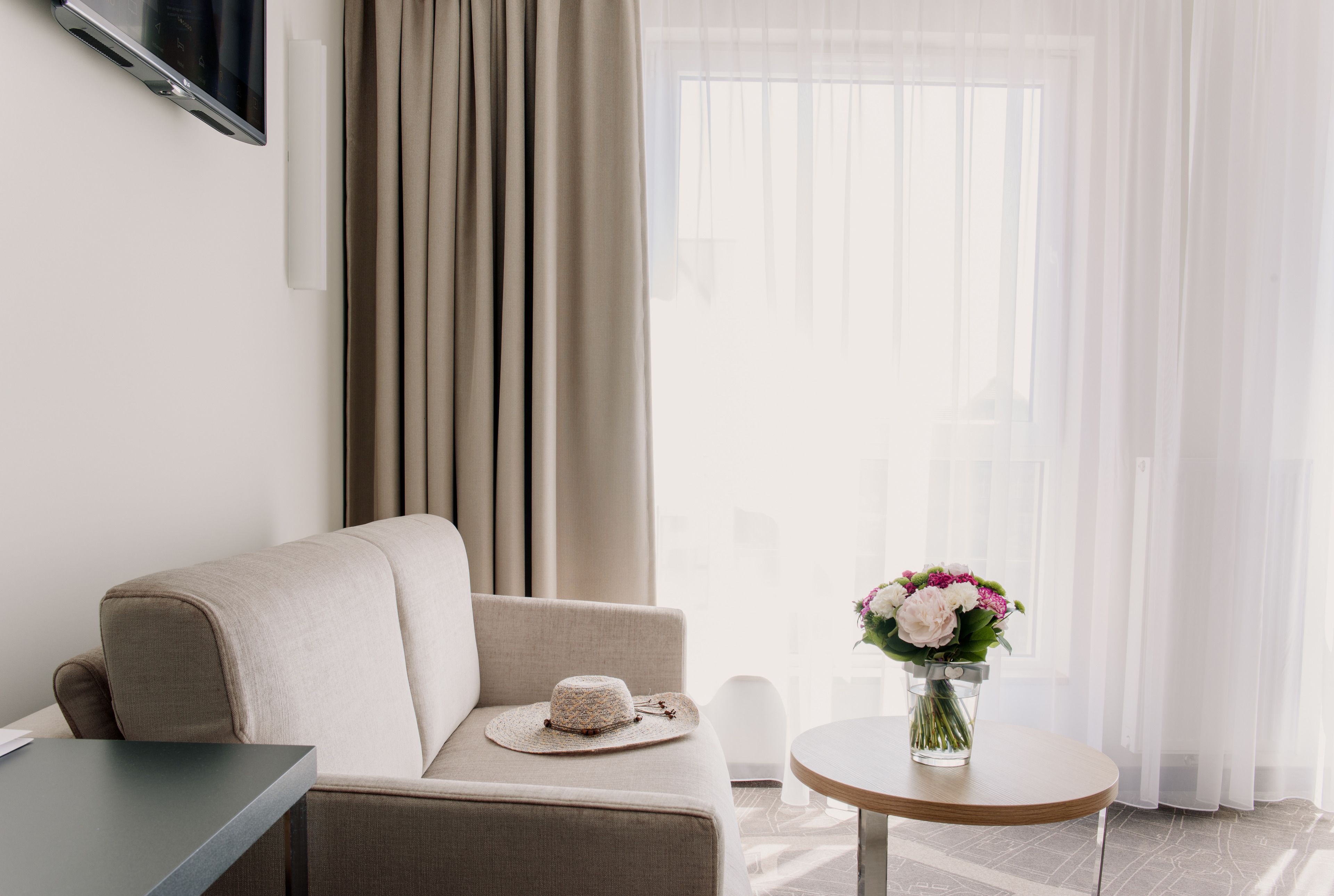 superior double or twin room | living area | flat-screen tv