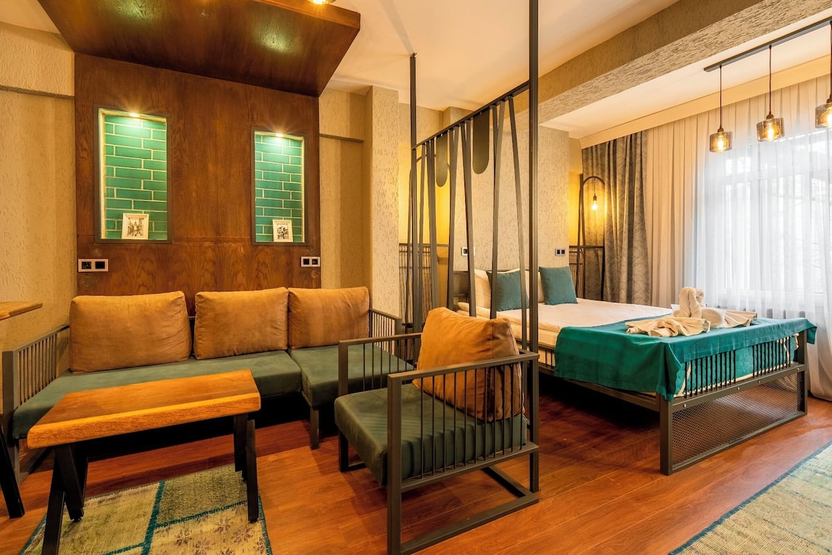 Family Suite, 1 Bedroom | In-room safe, desk, soundproofing, iron/ironing board