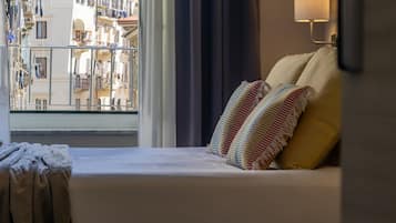 Premium bedding, down comforters, minibar, in-room safe