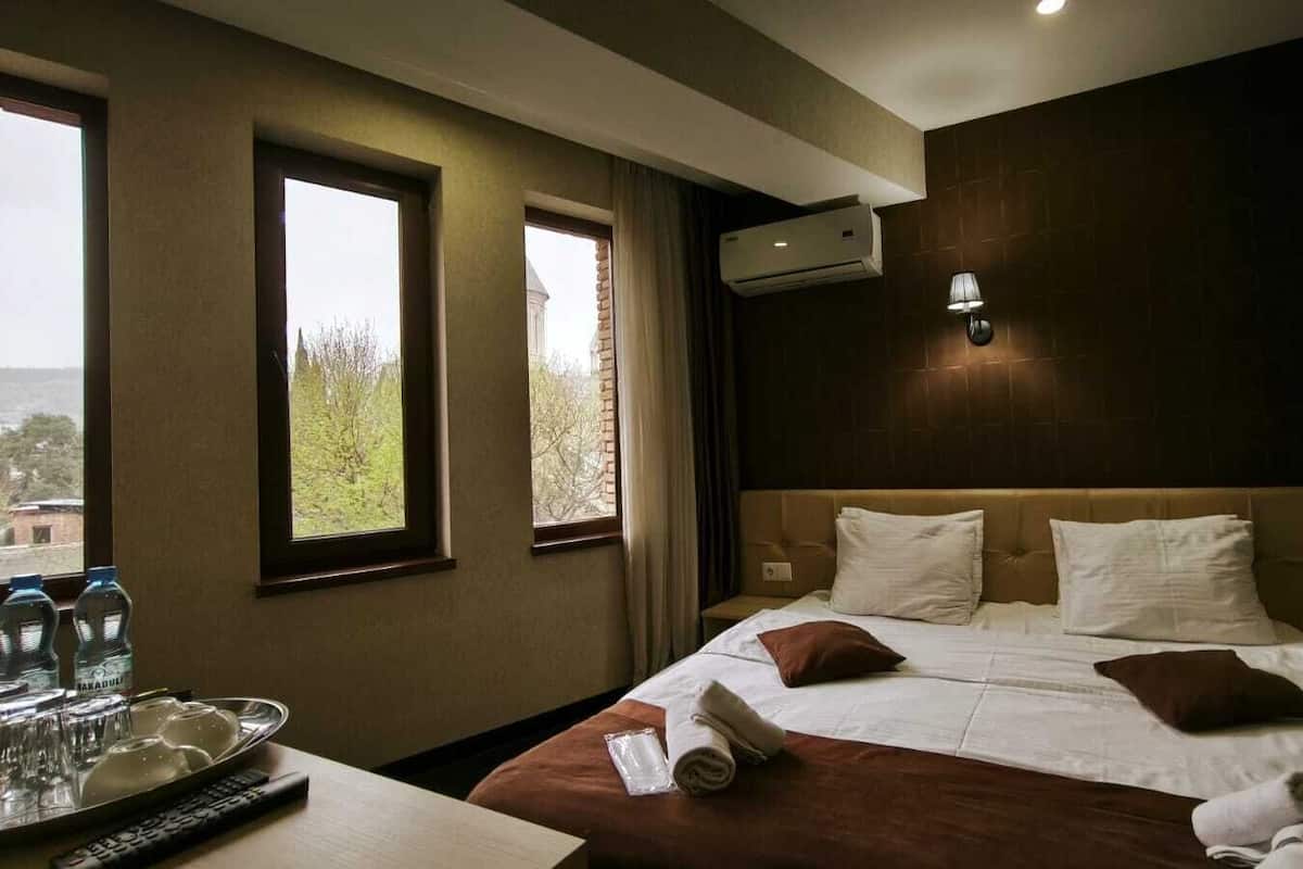 Family Quadruple Room, Mountain View | Premium bedding, in-room safe, soundproofing, iron/ironing board