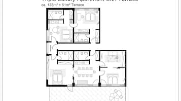 Plan d’étage d’un appartement de luxe en triplex doté d’une terrasse, comprenant un espace de vie, une cuisine, un coin repas et des chambres.