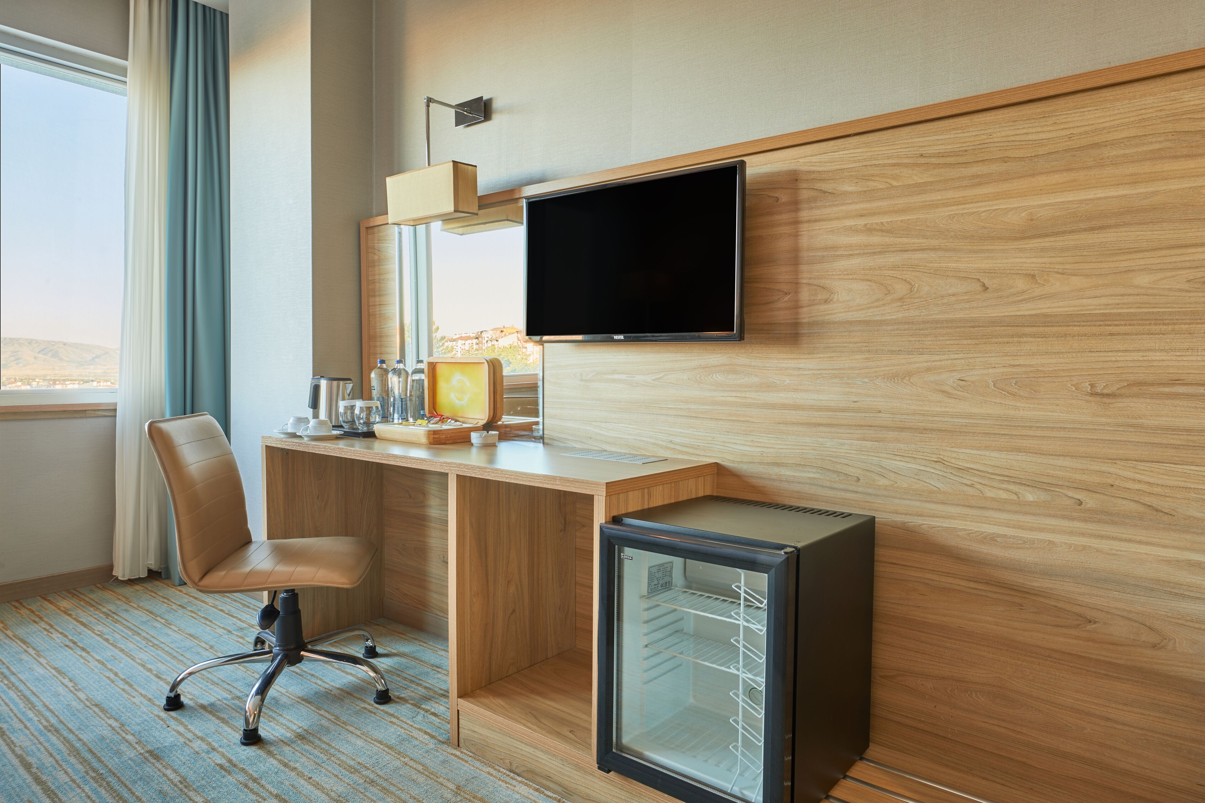 deluxe double room | living area | lcd tv