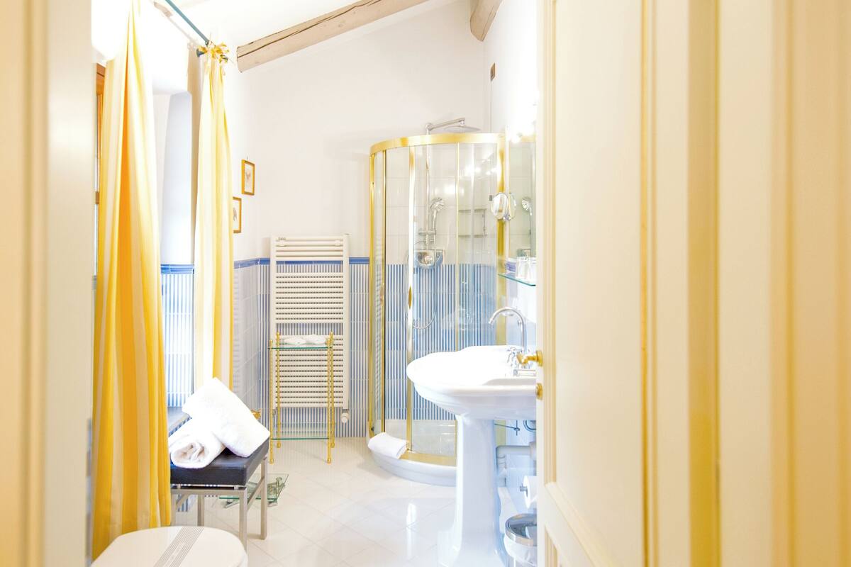 superior double room | bathroom | shower, free toiletries, hair dryer, bathrobes