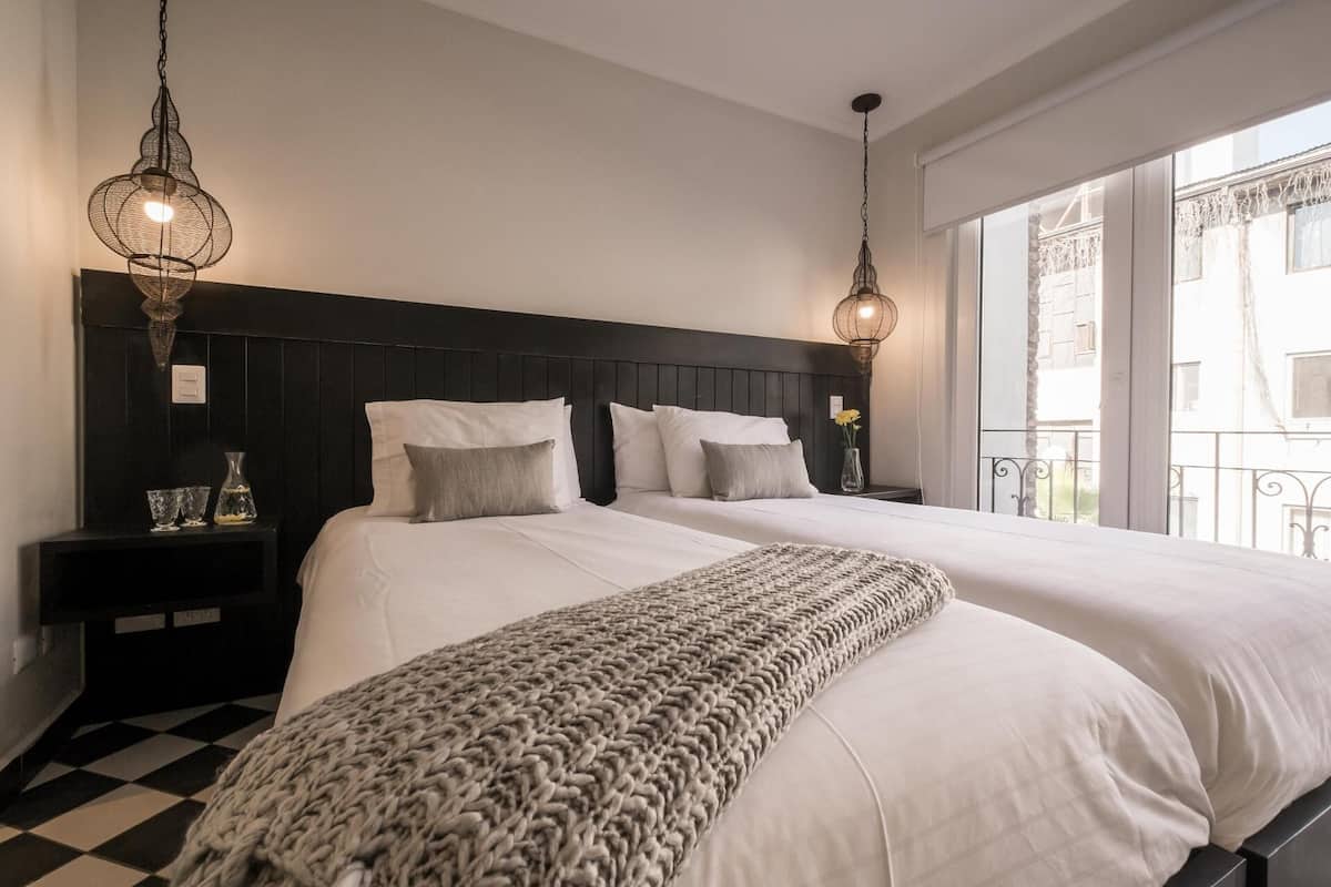 Down comforters, pillowtop beds, in-room safe, desk