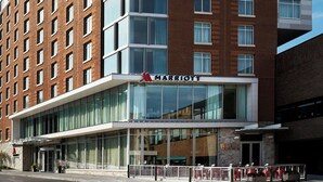 A multi-story hotel with a prominent 'Marriott' sign, large windows, and a modern architectural design. - Ithaca Marriott Downtown on the Commons (Ithaca)