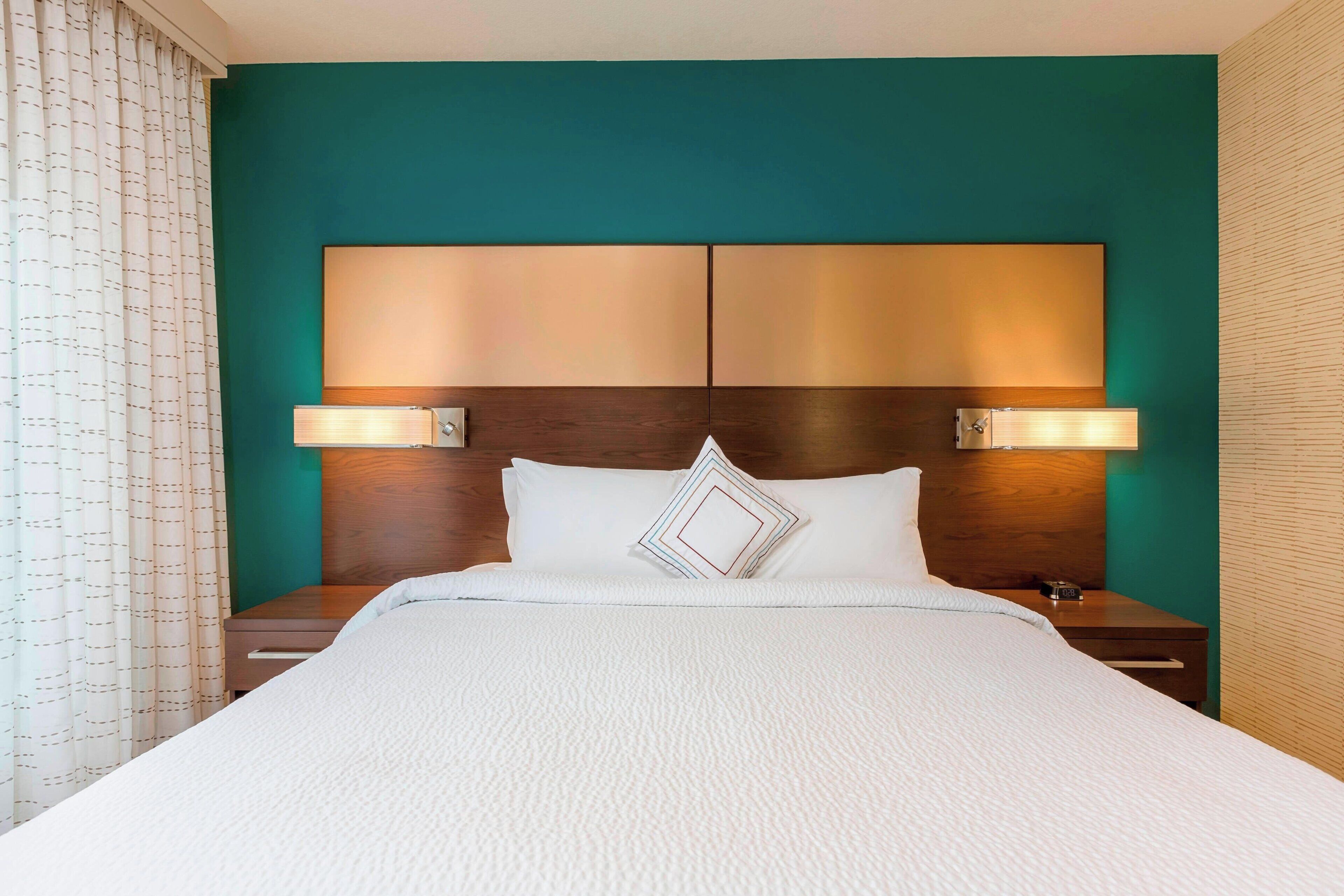 premium bedding, pillow-top beds, desk, laptop workspace