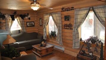 Cabin, 2 Bedrooms (Grizzly) | Living area | Flat-screen TV