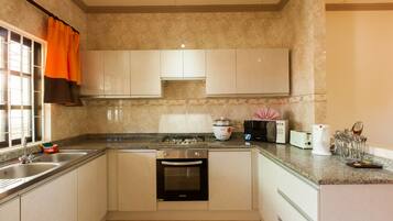 Apartment, 2 Bedrooms | Private kitchen | Coffee/tea maker, electric kettle