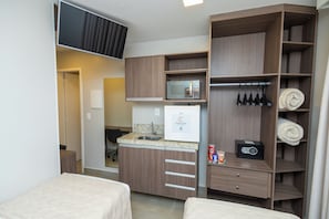 Economy Twin Room | Minibar, desk, laptop workspace, blackout drapes