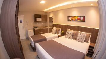 Standard Triple Room | Minibar, desk, laptop workspace, blackout curtains