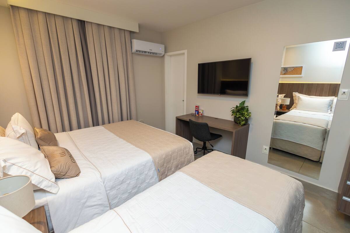 Standard Triple Room | Minibar, desk, laptop workspace, blackout drapes