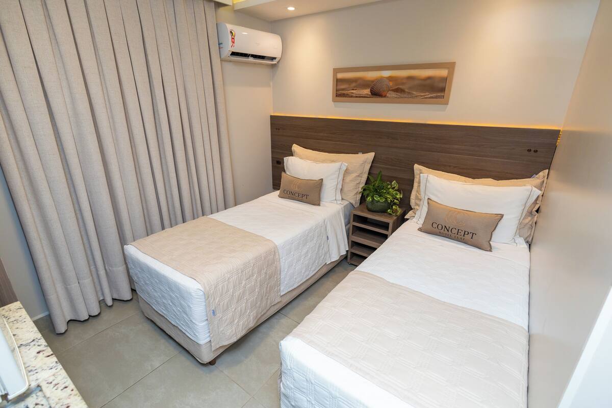 Economy Twin Room | Minibar, desk, laptop workspace, blackout drapes