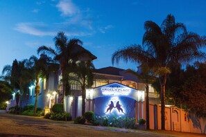 A hotel entrance with a sign reading "Angel's Place" and a silhouette of two people on the sign. - The Angels Place Boutique Hotel (Pretoria)