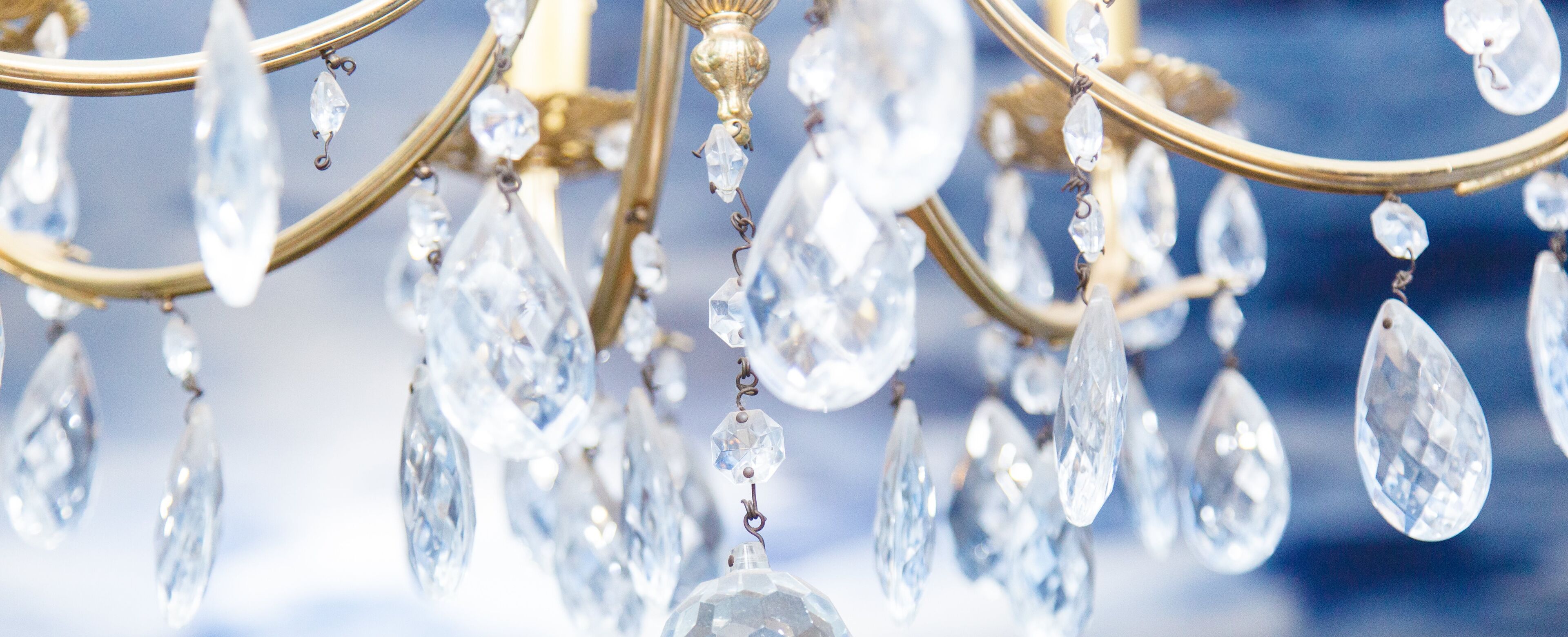 A chandelier with multiple crystal elements.