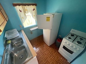 Fridge, microwave, electric kettle, cookware/dishes/utensils
