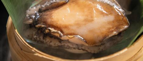 A steamed dish in a bamboo steamer.