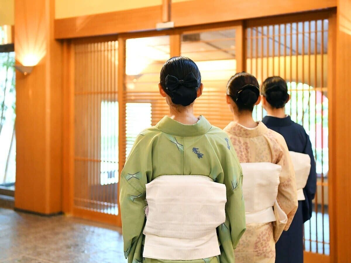 A traditional Japanese interior with sliding doors and a wooden floor.