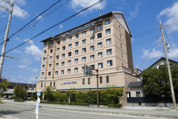 A multi-story hotel with a flat facade, numerous windows, and a sign indicating it is a hotel. - Ako Park Hotel (Ako)