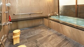 A modern bathroom with a bathtub, a shower, and a toilet. - Hotel Parens Onoya (Asakura)
